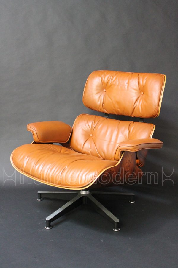 front view of brown leather eames lounge and ottoman photo
