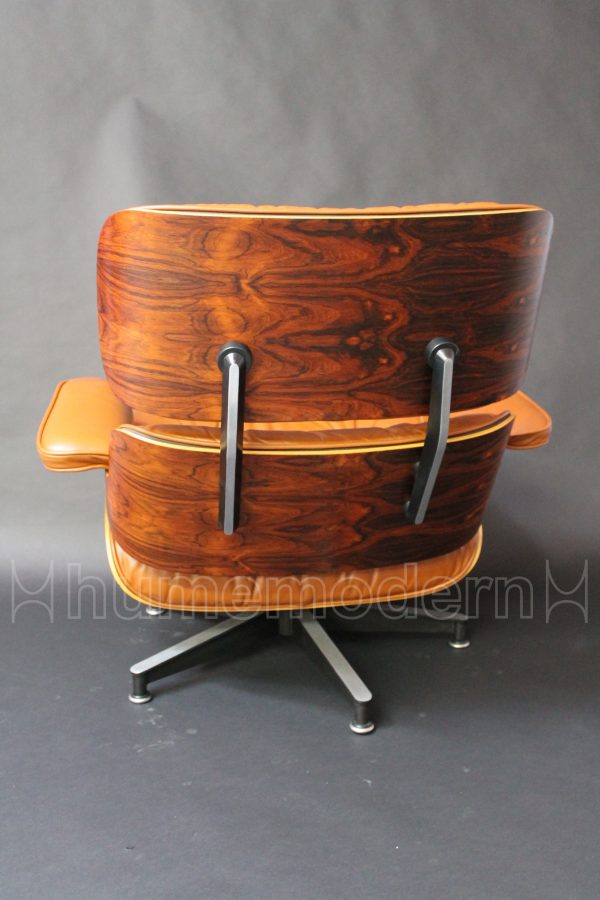 back view of brown leather eames lounge and ottoman photo