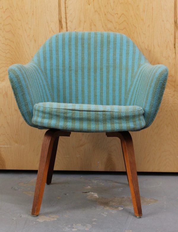 vintage saarinen arm chair with blue striped fabric and wood legs