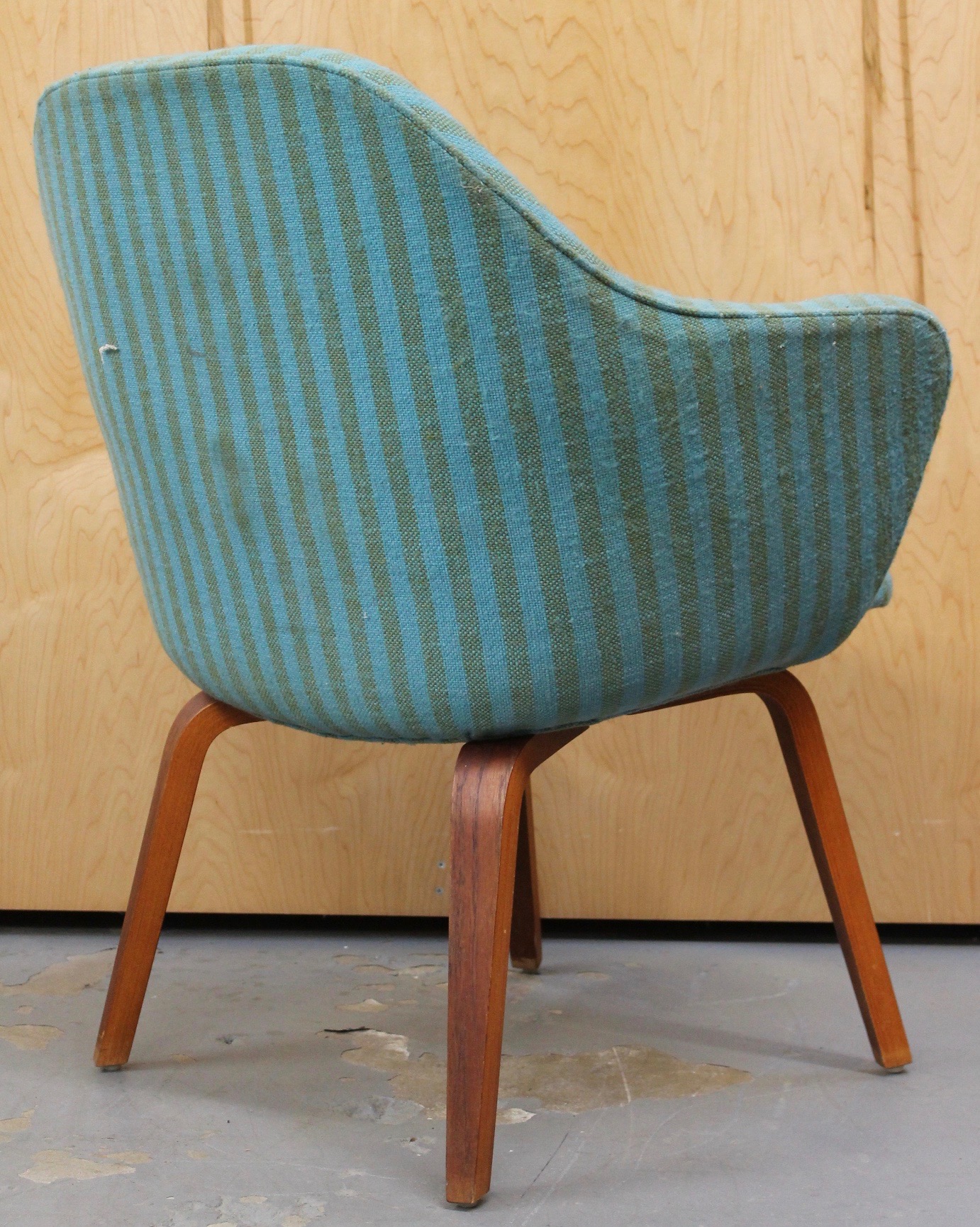 vintage saarinen arm chair with blue striped fabric and wooden legs