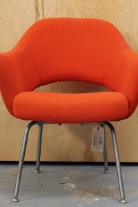 photo of front of vintage orange fabric chair with metal legs