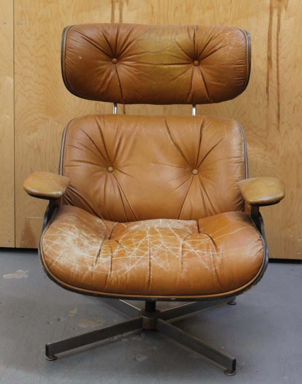photo of front of distressed brown leather lounge chair and ottoman