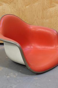 photo of eames red arm chair shell
