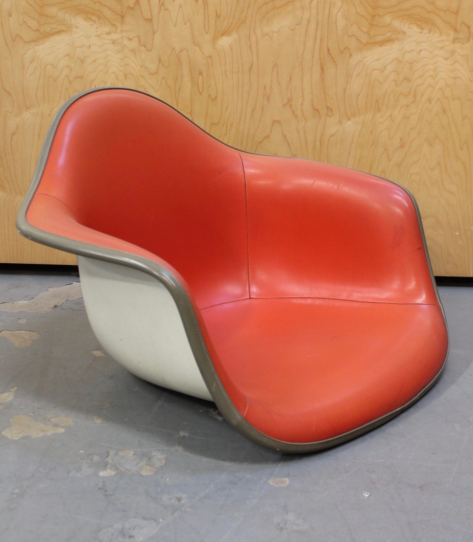 photo of eames red arm chair shell