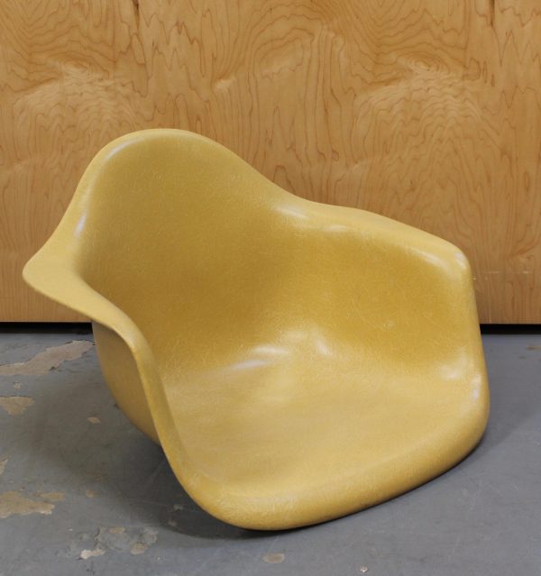 photo of front of eames mustard colored arm chair shell