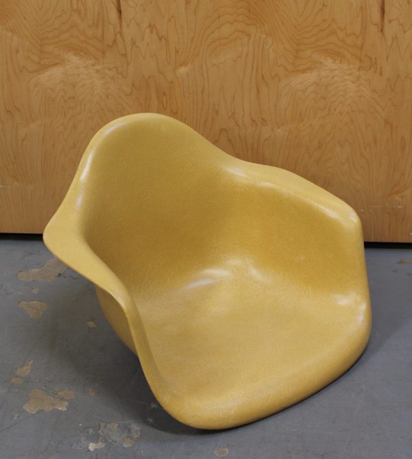 photo of front of eames mustard colored arm chair shell