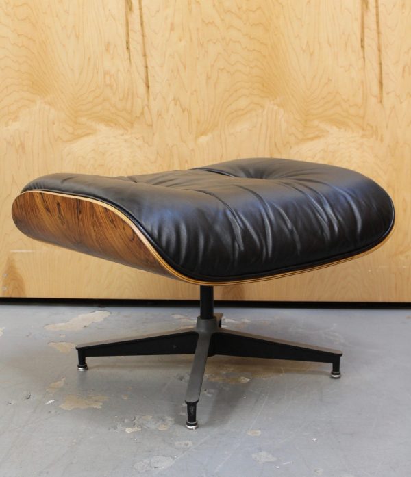 photo of rare Eames black leather and rosewood ottoman