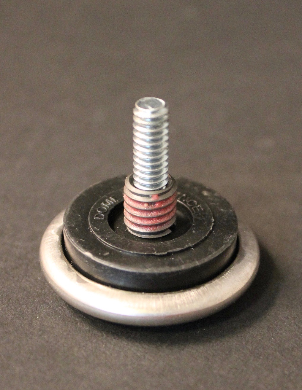 photo of lounge chair and ottoman slide foot with attached bolt