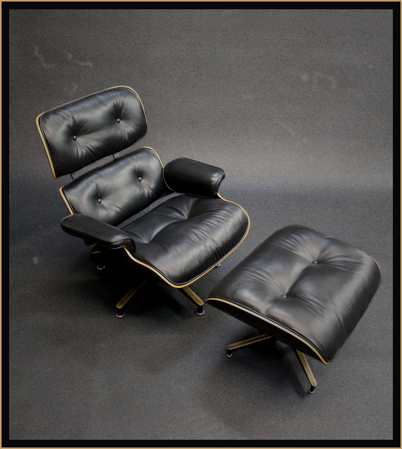 photo of vintage black leather lounge chair and ottoman