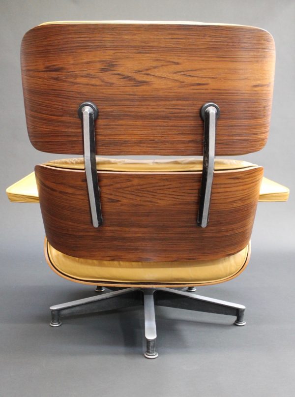 yellow eames lounge chair back view photo