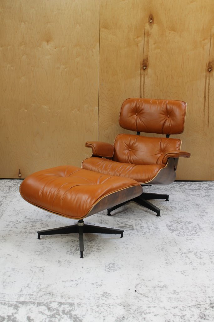 classic eames lounge and ottoman in burnt orange leather