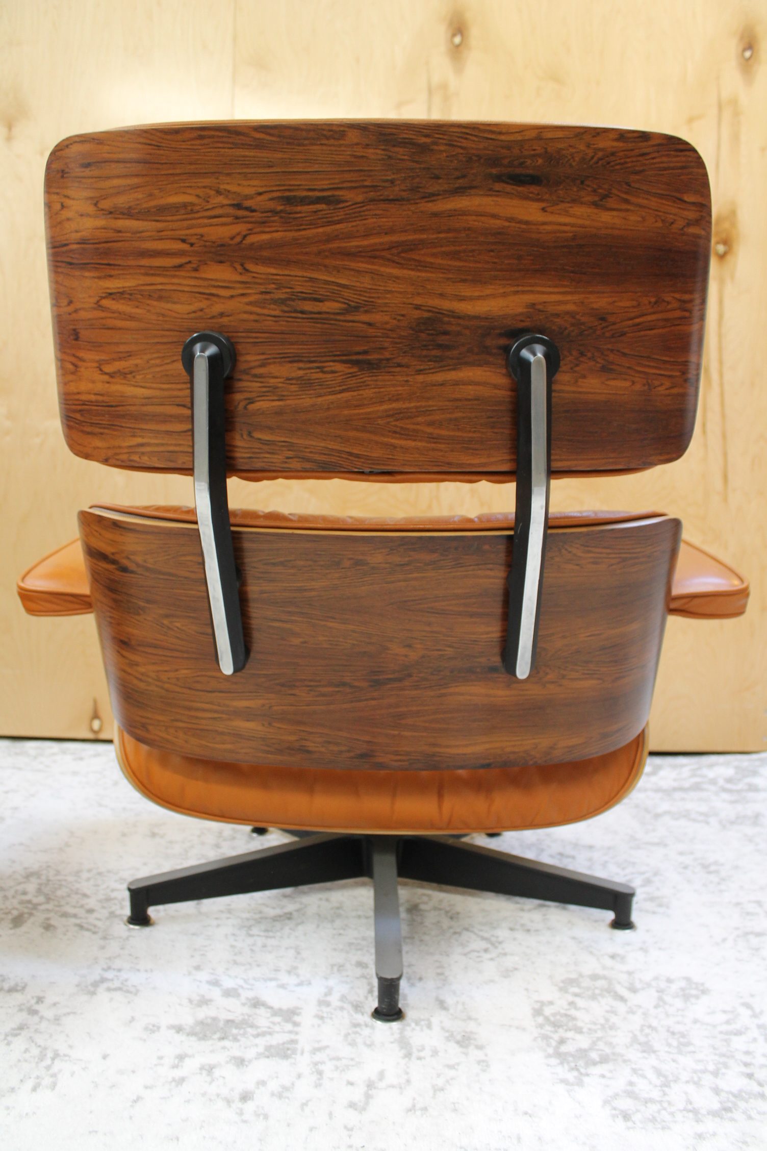 classic eames lounge and ottoman in burnt orange leather
