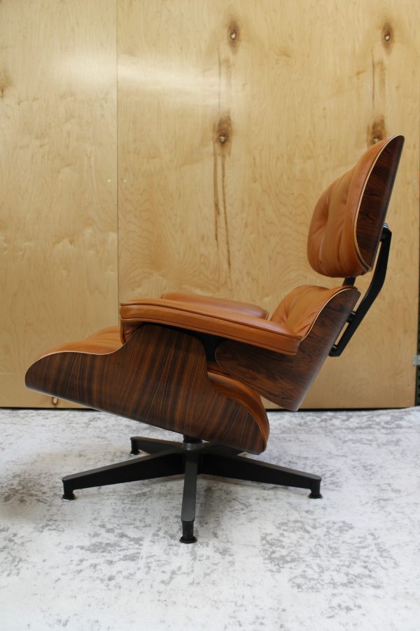 classic eames lounge and ottoman in burnt orange leather